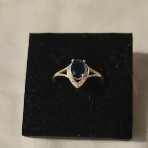 Source Unknown 925 Silver Ring with Deep Blue Oval Stone and Clear Accents